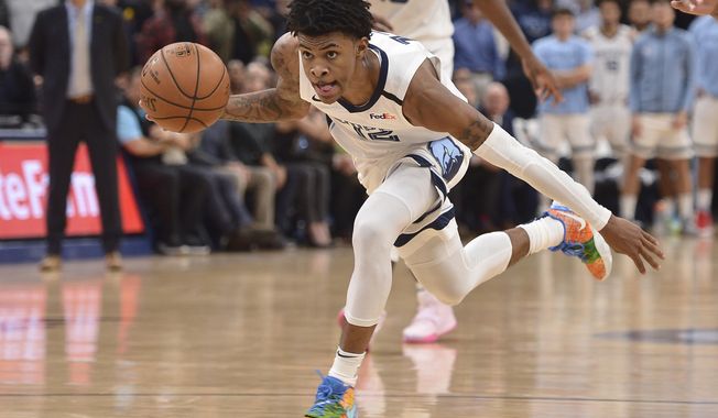 Memphis Grizzlies guard Ja Morant (12) handles the ball during the second half of the team&#x27;s NBA basketball game against the Minnesota Timberwolves on Tuesday, Jan. 7, 2020, in Memphis, Tenn. (AP Photo/Brandon Dill)