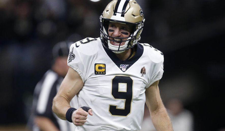 New Orleans Saints quarterback Drew Brees (9) celebrates a touchdown carry by Alvin Kamara in the first half of an NFL wild-card playoff football game against the Minnesota Vikings, Sunday, Jan. 5, 2020, in New Orleans. (AP Photo/Butch Dill)