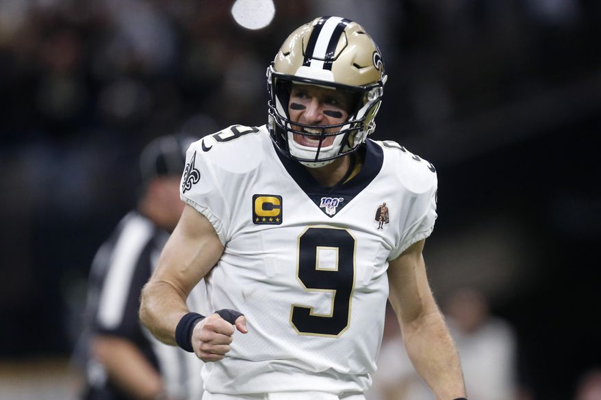New Orleans Saints quarterback Drew Brees (9) celebrates a touchdown carry by Alvin Kamara in the first half of an NFL wild-card playoff football game against the Minnesota Vikings, Sunday, Jan. 5, 2020, in New Orleans. (AP Photo/Butch Dill)
