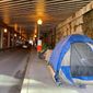 D.C. government workers cleared out all the tents on the sidewalk under the K Street Northeast underpass last week to make room for pedestrians. Many of those homeless folk moved to the L Street Northeast underpass. (Sophie Kaplan/The Washington Times) ** FILE **