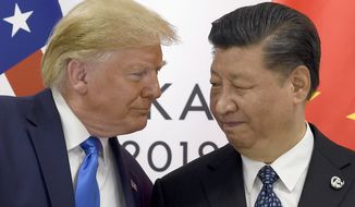 In this June 29, 2019, file photo, President Donald Trump, left, meets with Chinese President Xi Jinping during a meeting on the sidelines of the G-20 summit in Osaka, Japan. President Trump on Jan. 9, 2020, suggested that the balance of a far-reaching trade deal with China might be put off until after the 2020 election. (AP Photo/Susan Walsh, File) **FILE**