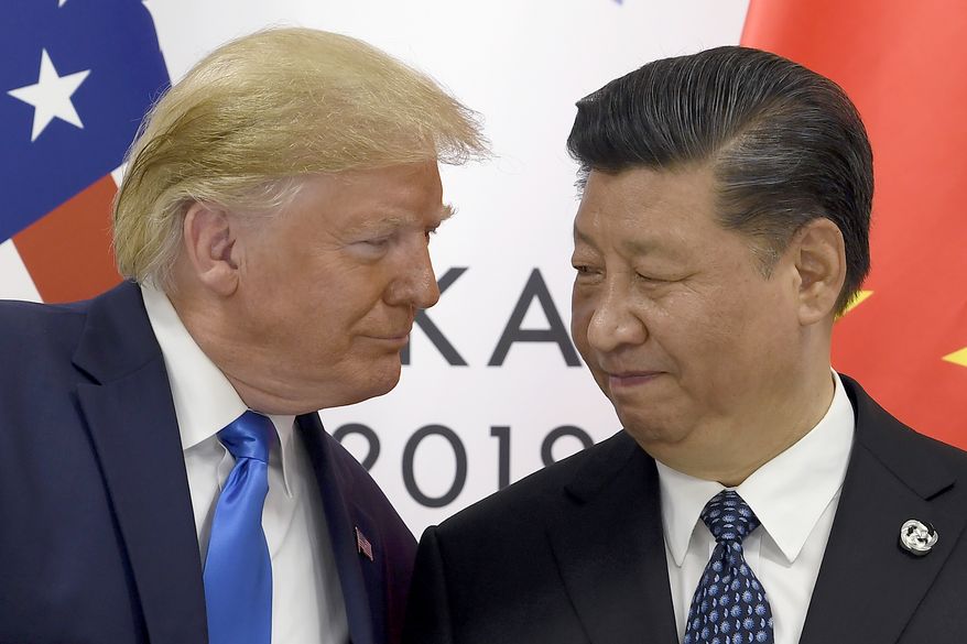 In this June 29, 2019, file photo, President Donald Trump, left, meets with Chinese President Xi Jinping during a meeting on the sidelines of the G-20 summit in Osaka, Japan. President Trump on Jan. 9, 2020, suggested that the balance of a far-reaching trade deal with China might be put off until after the 2020 election. (AP Photo/Susan Walsh, File) **FILE**