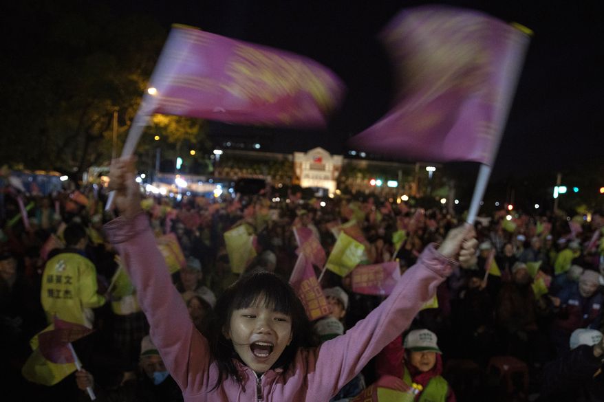In this Wednesday, Jan. 8, 2020, photo, supporters of Tsai Ing-wen, Taiwan's President and the 2020 presidential election candidate for the Democratic Progressive Party (DPP), cheer during an election campaign rally in northern Taiwan's Hsinchu province. A year ago, the Taiwan leader was on the ropes. Now President Tsai appears poised to win a second four-year term in elections this Saturday. (AP Photo/Ng Han Guan)