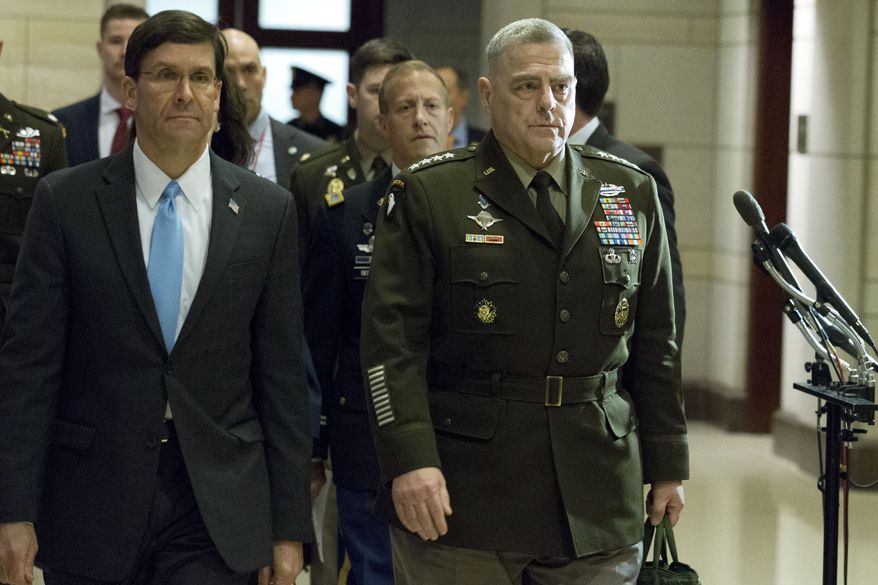 Secretary of Defense Mark Esper, accompanied by Joint Chiefs of Staff Chairman Gen. Mark Milley arrive to conduct briefings for members of Congress on last week&#39;s targeted killing of Iran&#39;s senior military commander Gen. Qassem Soleimani on Capitol Hill, in Washington, Wednesday, Jan. 8, 2020. (AP Photo/Jose Luis Magana)
