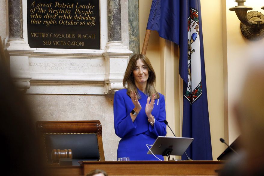 Virginia House of Delegates, Speaker Eileen Filler-Corn, D-Fairfax, applauds as she delivers remarks during opening ceremonies of the 2020 Virginia General Assembly at the Capitol in Richmond, Va., Wednesday, Jan. 8, 2020. Filler-Corn is the first woman to hold the position. (AP Photo/Steve Helber)