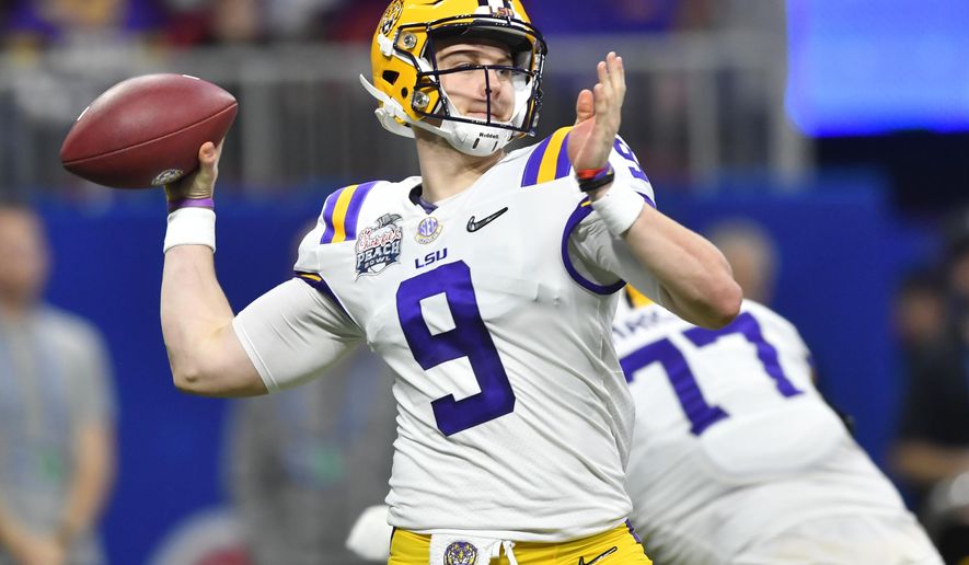 FILE - In this Dec. 28, 2019, file photo, LSU quarterback Joe Burrow (9) works against Oklahoma during the first half of the Peach Bowl NCAA semifinal college football playoff game, in Atlanta. LSU’s Joe Burrow and Justin Jefferson were easy selections for The Associated Press all-bowl team. The two connected for four first-half touchdowns in a College Football Playoff semifinal blowout of Oklahoma. (AP Photo/John Amis, File)