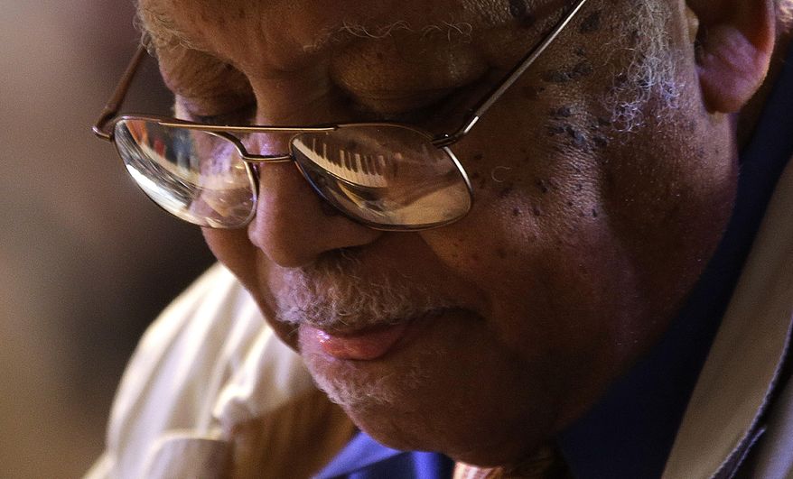 FILE - In this May 5, 2013 file photo, jazz pianist Ellis Marsalis performs at the New Orleans Jazz and Heritage Festival in New Orleans. Marsalis, a jazz legend and patriarch of the Marsalis family, is stepping down from the weekly Friday night show he’s done for about three decades at Snug Harbor in New Orleans. The 85-year-old Marsalis will still perform on occasion at the club along with other artists.(AP Photo/Gerald Herbert, File)
