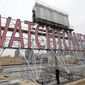 In this Dec. 9, 2015, file photo, the iconic Watchtower sign is seen on the roof of 25-30 Columbia Heights, then world headquarters of the Jehovah&#39;s Witnesses, in the Brooklyn borough of New York.  (AP Photo/Seth Wenig, File)  **FILE**