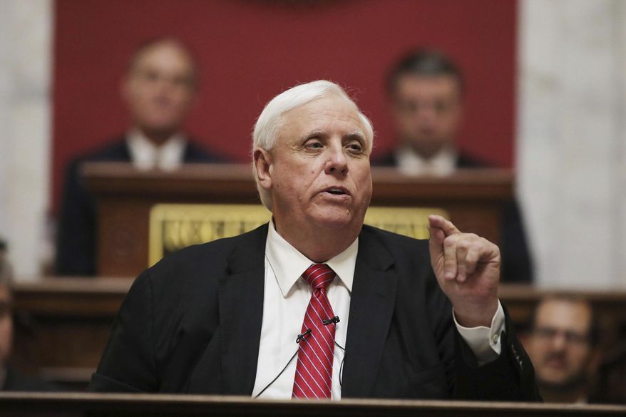 West Virginia Governor Jim Justice delivers his annual State of the State address in the House Chambers at the state capitol, Wednesday, Jan. 8, 2020, in Charleston, W.Va. (AP Photo/Chris Jackson)
