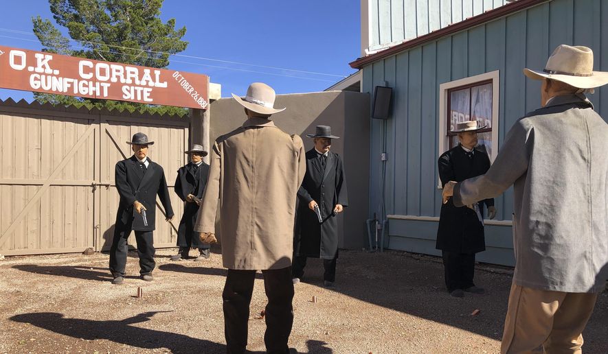 Life-sized replicas of the men who took part in a famous shootout in Tombstone, Ariz., are seen at the OK Corral in Tombstone on Saturday, Nov. 30, 2019. The men, lawmen and cowboys, are positioned as they were during the confrontation that left three dead and became one of the most famous shootouts in the Old West. (AP Photo/Peter Prengaman)