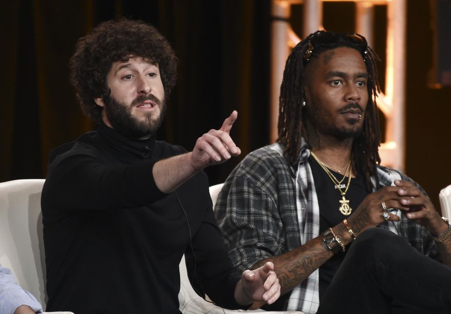 Dave Burd, left, the co-creator/executive producer/writer/star of the FX comedy series "Dave," makes a point alongside cast member GaTa during a panel discussion on the show at the 2020 FX Networks Television Critics Association Winter Press Tour, Thursday, Jan. 9, 2020, in Pasadena, Calif. (AP Photo/Chris Pizzello)