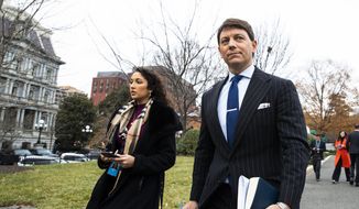 White House deputy press secretary Hogan Gidley walks back to the West Wing of the White House after speaking to reporters, Friday, Dec. 6, 2019, in Washington. (AP Photo/Manuel Balce Ceneta)