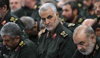 In this Sept. 18, 2016, file photo provided by an official website of the office of the Iranian supreme leader, Revolutionary Guard Gen. Qassem Soleimani, center, attends a meeting in Tehran, Iran. Soleimani, the head of Irans elite Quds Force, was killed in an airstrike at Baghdad&#39;s international airport, in January 2020. A UN report released in July 2020, says the U.S. violated international law in the targeted killing. (Office of the Iranian Supreme Leader via AP, File)  **FILE**