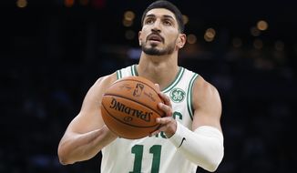 FILE - In this Sunday, Oct. 6, 2019 file photo, Boston Celtics&#39; Enes Kanter plays against the Charlotte Hornets during the first half of a preseason NBA basketball game in Boston. Former Oklahoma City Thunder player Enes Kanter plans to open a charter school in the city. Kanter, who now plays for the Boston Celtics, has told Oklahoma City Public Schools of his plan to open the Enes Kanter School for Exceptional Learning. (AP Photo/Michael Dwyer)