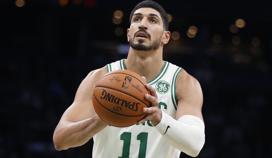 FILE - In this Sunday, Oct. 6, 2019 file photo, Boston Celtics&#39; Enes Kanter plays against the Charlotte Hornets during the first half of a preseason NBA basketball game in Boston. Former Oklahoma City Thunder player Enes Kanter plans to open a charter school in the city. Kanter, who now plays for the Boston Celtics, has told Oklahoma City Public Schools of his plan to open the Enes Kanter School for Exceptional Learning. (AP Photo/Michael Dwyer)