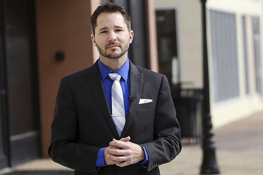 In this Jan. 24, 2018 photo, Biloxi Councilman Robert L. Deming poses along Howard Avenue in Biloxi, Miss. Deming is filing papers Thursday, Jan. 9, 2020, to challenge U.S. Rep. Steven Palazzo in south Mississippi's 4th Congressional District. (Amanda McCoy/The Sun Herald via AP)/The Sun Herald via AP)