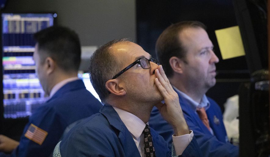 FILE - In this Jan. 2, 2020, file photo traders monitor stock prices at the New York Stock Exchange. The U.S. stock market opens at 9:30 a.m. EST on Thursday, Jan. 9. (AP Photo/Mark Lennihan, File)