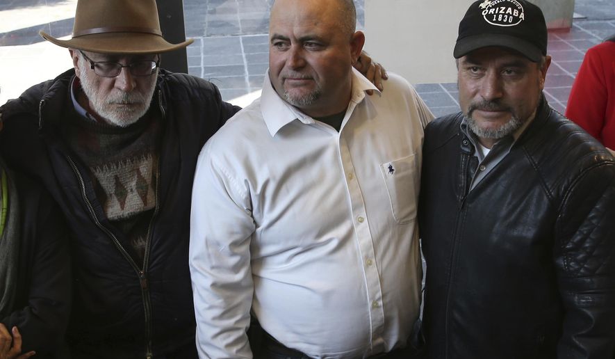 Mexican writer and activist Javier Sicilia, left, Julian, center, and Adrian LeBaron, who lost relatives and friends in a Nov. 4, 2019 ambush in northern Mexico, pose for photos during a press conference in Mexico City, Thursday, Jan. 9, 2020. Sicilia and other activists are calling to march against violence on Jan. 23, from Cuernavaca, Morelos state, to the National Palace in the Mexico’s capital. (AP Photo/Marco Ugarte)