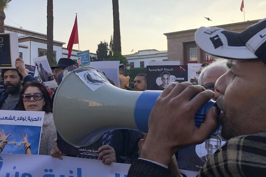 Dozens of people gathered in front of Rabat Parliament to denounce the situation of freedom of speechin Rabat, Thursday Jan 9 2020. Authorities across Morocco escalated a nationwide persecution of dissenting voices during 2019 that has activists and rights associations worried over a growing state-control of free speech on social media, considered the last remaining venue for Moroccans to speak freely. (AP Photo/Nadine Achoui-Lesage)