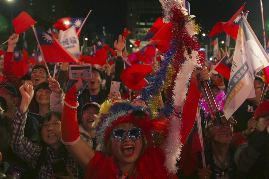 Supporters of Han Kuo-yu, Taiwan's 2020 presidential election candidate for the KMT or Nationalist Party, attend a campaign rally in Taipei, Taiwan, Thursday, Jan. 9, 2020. Taiwan will hold its presidential election on Jan. 11. (AP Photo/Ng Han Guan)