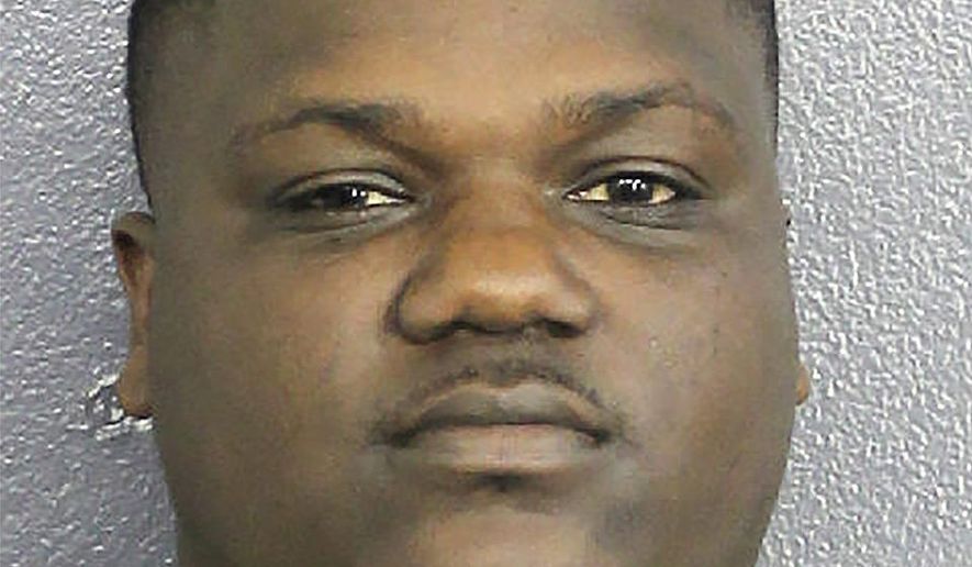 In this Jan. 4, 2020, photo made available by the Broward Sheriff's Office, Chauncy Devonte Lump is under arrest. Authorities charged Lump with threatening to kill President Trump in retaliation for the killing of Iranian Gen. Qassem Soleimani. (Broward County Sheriff's Office via AP)