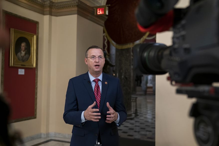 Rep. Doug Collins, R-Georgia, the top Republican on the House Judiciary Committee, does a tv news interview just outside the House chamber, Friday, Jan. 10, 2020, at the Capitol in Washington. Speaker of the House Nancy Pelosi, D-Calif., has not yet relayed the articles of impeachment to the Senate for trial three weeks since President Donald Trump was impeached on charges of abuse and obstruction. (AP Photo/J. Scott Applewhite)