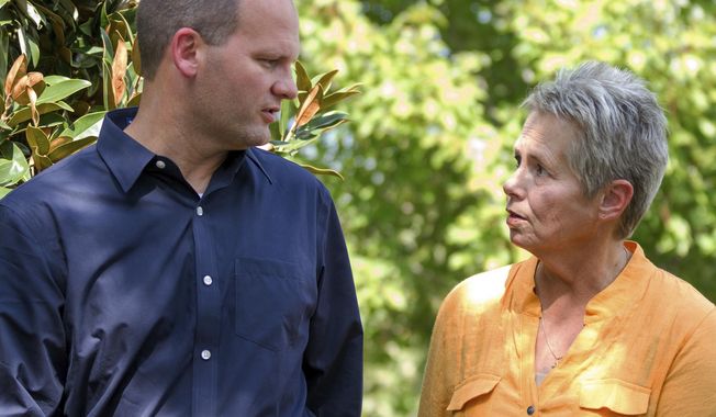 FILE - In this Sept. 27, 2013 file photo, Gaile Owens and son Stephen Owens walk together in Nashville, Tenn.  When Owens left the Tennessee Prison for Women in 2011, after more than two decades on death row, her life seemed a textbook example of redemption. Sentenced to death for hiring a hit man to murder her husband in 1985, Owens had turned her life around, reconciled with her oldest son and received clemency.   (AP Photo/Erik Schelzig, File)