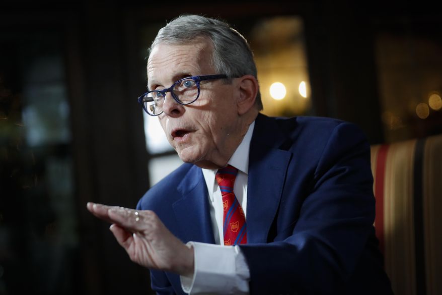 FILE - In this Friday, Dec. 13, 2019, file photo, Ohio Gov. Mike DeWine speaks during an interview at the Governor's Residence in Columbus, Ohio. A new report is questioning the effectiveness of an expansion of electronic monitoring of inmates in Ohio. The 77-page report was presented Monday, Jan. 6, 2020, to DeWine's task force looking at how inmates are supervised after release. (AP Photo/John Minchillo, File)