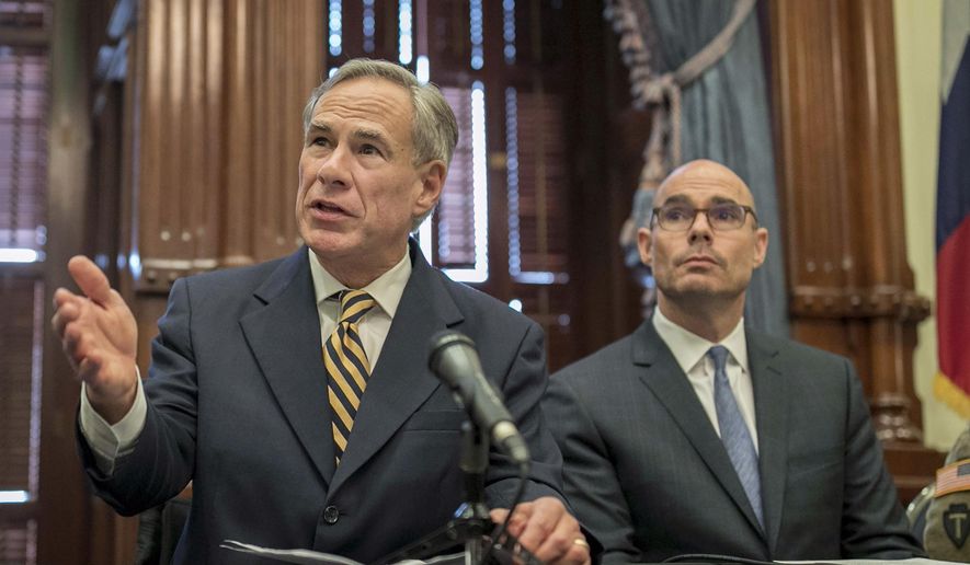 In this June 21, 2019, photo, Gov. Greg Abbott (left) speaks at a news conference at the Capitol, in Austin, Texas. (Jay Janner/Austin American-Statesman via AP) ** FILE **