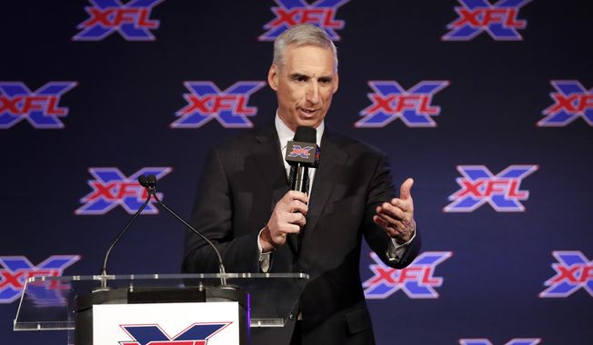 In this Feb. 7, 2019, file photo, Oliver Luck, XFL Commissioner and CEO, makes comments during a news conference in Arlington, Texas, Thursday, Feb. 7, 2019. (AP Photo/Tony Gutierrez) ** FILE **