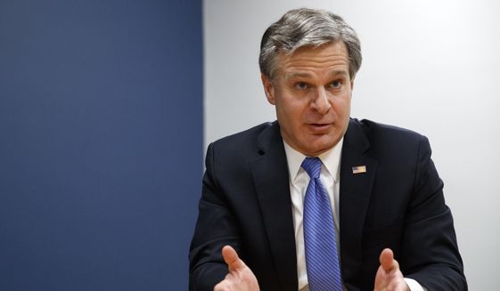 In this Dec. 9, 2019, file photo, FBI Director Christopher Wray speaks during an interview with The Associated Press in Washington. (AP Photo/Jacquelyn Martin, File)