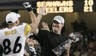 FILE - In this Sunday, Feb. 5, 2006 file photo, Pittsburgh Steelers head coach Bill Cowher high-fives Hines Ward (86), MVP of the Super Bowl XL football game, after they defeated the Seattle Seahawks, 21-10 in Detroit. Former Pittsburgh Steelers coach Bill Cowher has been elected to the Pro Football Hall of Fame. Cowher, an analyst for CBS, was surprised by the announcement made live on air in studio before the Tennessee Titans-Baltimore Ravens AFC divisional round playoff game Saturday night, Jan. 11, 2020. (AP Photo/Elaine Thompson, File)