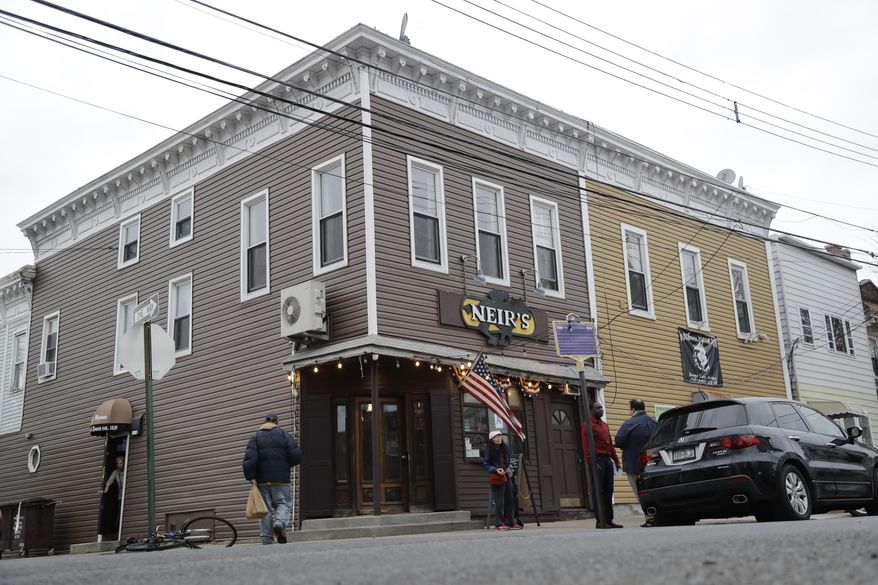 Patrons gather outside of Neir's Tavern on Saturday, Jan. 11, 2020, in the Queens borough of New York. The 190-year-old New York City tavern where scenes from the movie "Goodfellas" were filmed will stay open thanks to a deal reached Friday by the bar's owner and his landlord, city officials said. (AP Photo/Frank Franklin II)