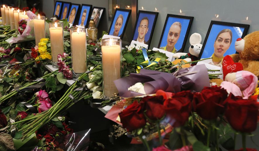 Flowers and candles are placed in front of portraits of the flight crew members of the Ukrainian 737-800 plane that crashed on the outskirts of Tehran, at a memorial inside Borispil international airport outside Kyiv, Ukraine, Saturday, Jan. 11, 2020. Ukraine&#39;s President Volodymyr Zelenskiy says that Iran must take further steps following its admission that one of its missiles shot down Ukrainian civilian airliner. He also expressed hope for the continuation of the crash investigation without delay. A team of Ukrainian investigators is in Iran. (AP Photo/Efrem Lukatsky)
