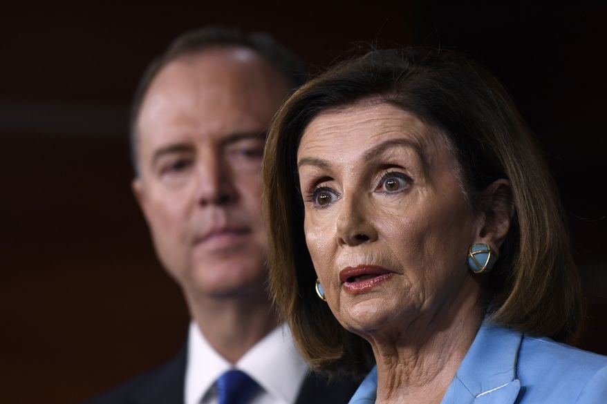 House Speaker Nancy Pelosi of Calif., right, joined by House Intelligence Committee Chairman Rep. Adam Schiff, D-Calif., left, speaks during a news conference on Capitol Hill in Washington, Wednesday, Oct. 2, 2019 (AP Photo/Susan Walsh)