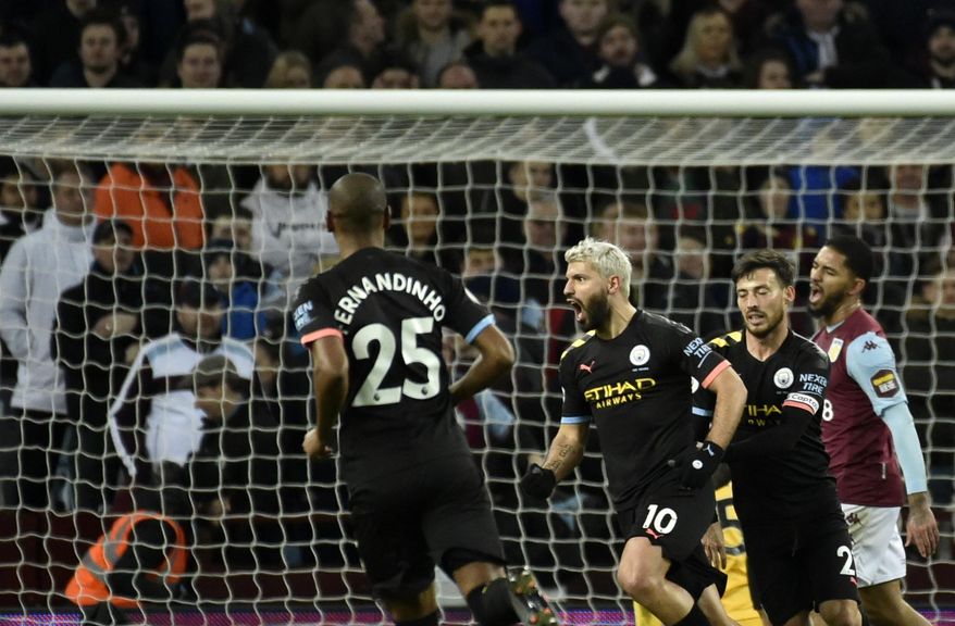 Manchester City's Sergio Aguero, center, celebrates with teammates after scoring his side's third goal during the English Premier League soccer match between Aston Villa and Manchester City at Villa Park in Birmingham, England, Sunday, Jan. 12, 2020. (AP Photo/Rui Vieira)