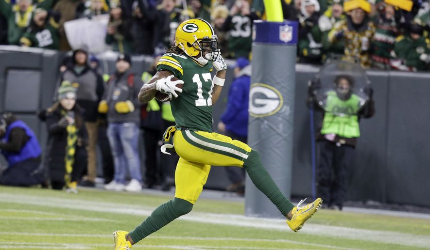 Green Bay Packers' Davante Adams runs to the endzone for his touchdown catch during the second half of an NFL divisional playoff football game against the Seattle Seahawks Sunday, Jan. 12, 2020, in Green Bay, Wis. (AP Photo/Darron Cummings)