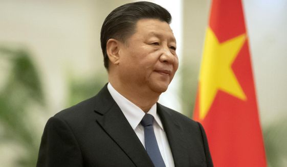 In this Jan. 6, 2020, file photo, Chinese President Xi Jinping stands during a welcome ceremony for Kiribati&#39;s President Taneti Maamau at the Great Hall of the People in Beijing. (AP Photo/Mark Schiefelbein, File)