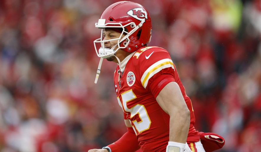 Kansas City Chiefs quarterback Patrick Mahomes (15) reacts after a Chiefs' touchdown during the first half of an NFL divisional playoff football game against the Houston Texans, in Kansas City, Mo., Sunday, Jan. 12, 2020. (AP Photo/Jeff Roberson)