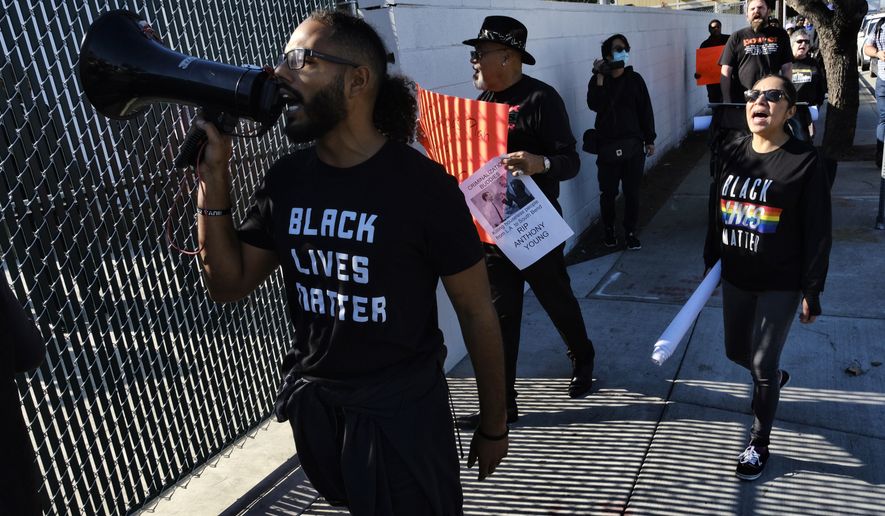 Protesters with Black Lives Matter protest a visit by Democratic presidential candidate and former South Bend, Ind., Mayor Pete Buttigieg, at A Bridge Home Project homeless shelter in Los Angeles, Friday, Jan. 10, 2020. (AP Photo/Richard Vogel)