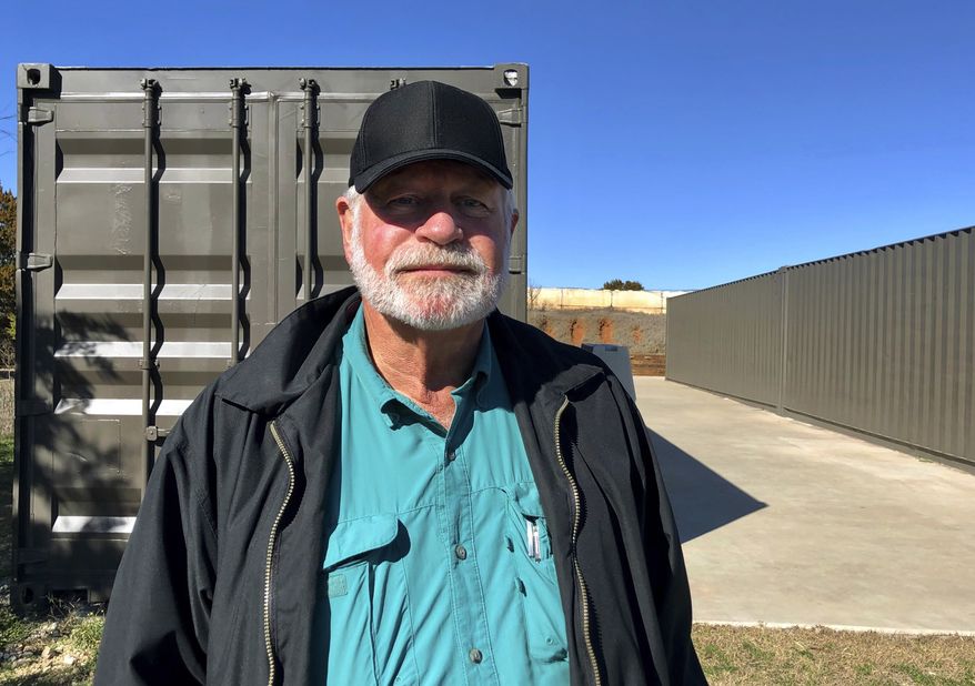 In this Dec. 30, 2019, file photo, Jack Wilson, poses for a photo at a firing range outside his home in Granbury, Texas. Gov. Greg Abbott of Texas presented the state's highest civilian honor, the Governor's Medal of Courage, to Wilson, who shot and killed a gunman who opened fire at a church in December, on Monday, Jan. 13, 2020. (AP Photo/Jake Bleiberg File)