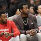 Washington Wizards guard John Wall, right, watches from the bench next to guard Jordan McRae, left, during the first half of an NBA basketball game, Sunday, Jan. 12, 2020, in Washington. (AP Photo/Nick Wass) ** FILE **