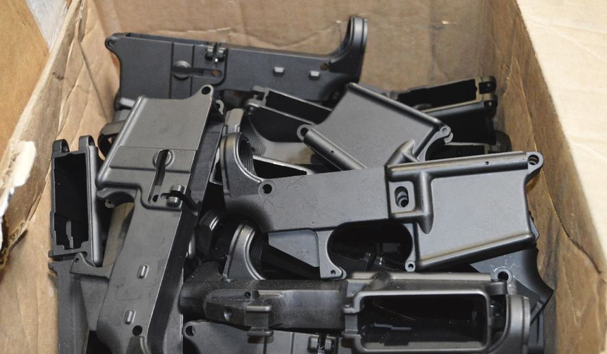 This photo provided by the U.S. Department of Justice shows AR-15 lower receivers, which federal agents have seized, including these unfinished ones taken in 2014 in California, for firearms investigations nationwide. For decades, the federal government has treated the mechanism called the lower receiver as the essential piece of the semiautomatic rifle, which has been used in some of the nation&#39;s deadliest mass shootings. But some defense attorneys have recently argued that the part alone does not meet the definition in the law. (U.S. Department of Justice via AP)