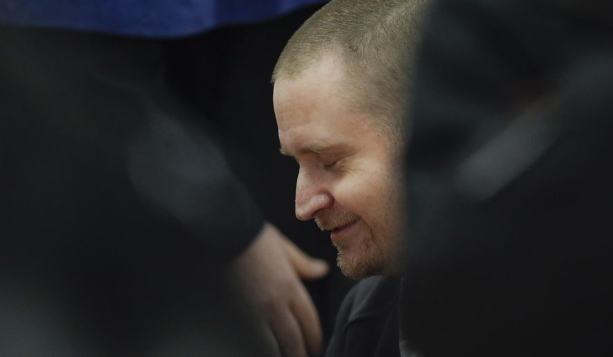 In this file picture taken on Thursday, Dec. 19, 2019, Miroslav Marcek, one of the suspected shooters, sits in a courtroom ahead of the trial in Pezinok, Slovakia. Marcek has pleaded guilty during a trial session on Monday Jan. 13, 2020. The prosecutors said Marcek shot dead Jan Kuciak and Martina Kusnirova in their home on Feb. 21, 2018. The 27-year-old reporter was shot in the chest and Kusnirova was shot in the head in the town of Velka Maca, east of Bratislava, they said. (AP Photo/Petr David Josek/File)