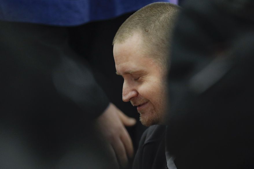 In this file picture taken on Thursday, Dec. 19, 2019, Miroslav Marcek, one of the suspected shooters, sits in a courtroom ahead of the trial in Pezinok, Slovakia. Marcek has pleaded guilty during a trial session on Monday Jan. 13, 2020. The prosecutors said Marcek shot dead Jan Kuciak and Martina Kusnirova in their home on Feb. 21, 2018. The 27-year-old reporter was shot in the chest and Kusnirova was shot in the head in the town of Velka Maca, east of Bratislava, they said. (AP Photo/Petr David Josek/File)