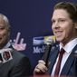 Washington Capitals center Nicklas Backstrom, right, of Sweden, speaks during an NHL hockey news conference about the Capitals re-signing him to a five-year contract, Tuesday, Jan. 14, 2020, in Washington. At left is Capitals general manager Brian MacLellan. (AP Photo/Nick Wass)
