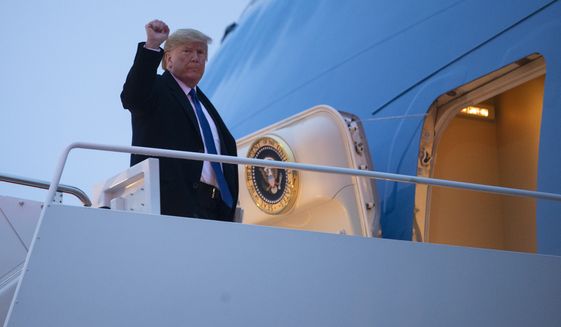 President Donald Trump boards Air Force One for a trip to Milwaukee to attend a campaign rally, Tuesday, Jan. 14, 2020, in Andrews Air Force Base, Md. (AP Photo/ Evan Vucci)