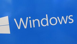 This Aug. 7, 2017, file shows a Microsoft Widows sign on display at a store in Hialeah, Fla. The National Security Agency has discovered a major security flaw in Microsoft&#39;s Windows operating system. Microsoft says the NSA notified the company about it. A fix was made available Tuesday, Jan. 14, 2020. (AP Photo/Alan Diaz)