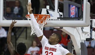 Nebraska&#x27;s Cam Mack, left, tries to shoot over Ohio State&#x27;s E.J. Liddell during the second half of an NCAA college basketball game Tuesday, Jan. 14, 2020, in Columbus, Ohio. Ohio State defeated Nebraska 80-68. (AP Photo/Jay LaPrete)