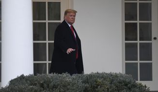 President Donald Trump walks along the colonnade of the White House in Washington, Monday, Jan. 13, 2020. A U.S. cybersecurity company says Russian military agents successfully hacked the Ukrainian gas company at the center of the scandal that led to President Donald Trump&#39;s impeachment. (AP Photo/Susan Walsh)